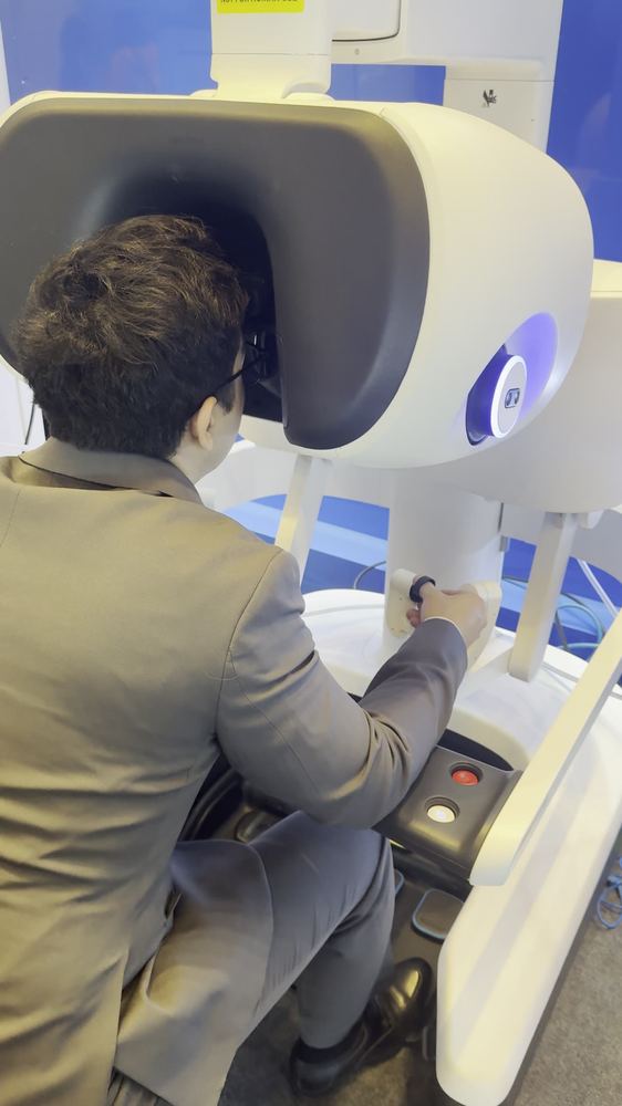 Video still of Asadbek Sultonov with the da Vinci surgical robot