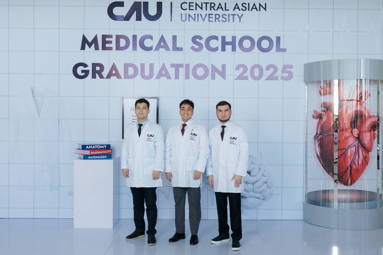 Asadbek Sultonov with two classmates in white coats at Central Asian University's Medical School Graduation 2025