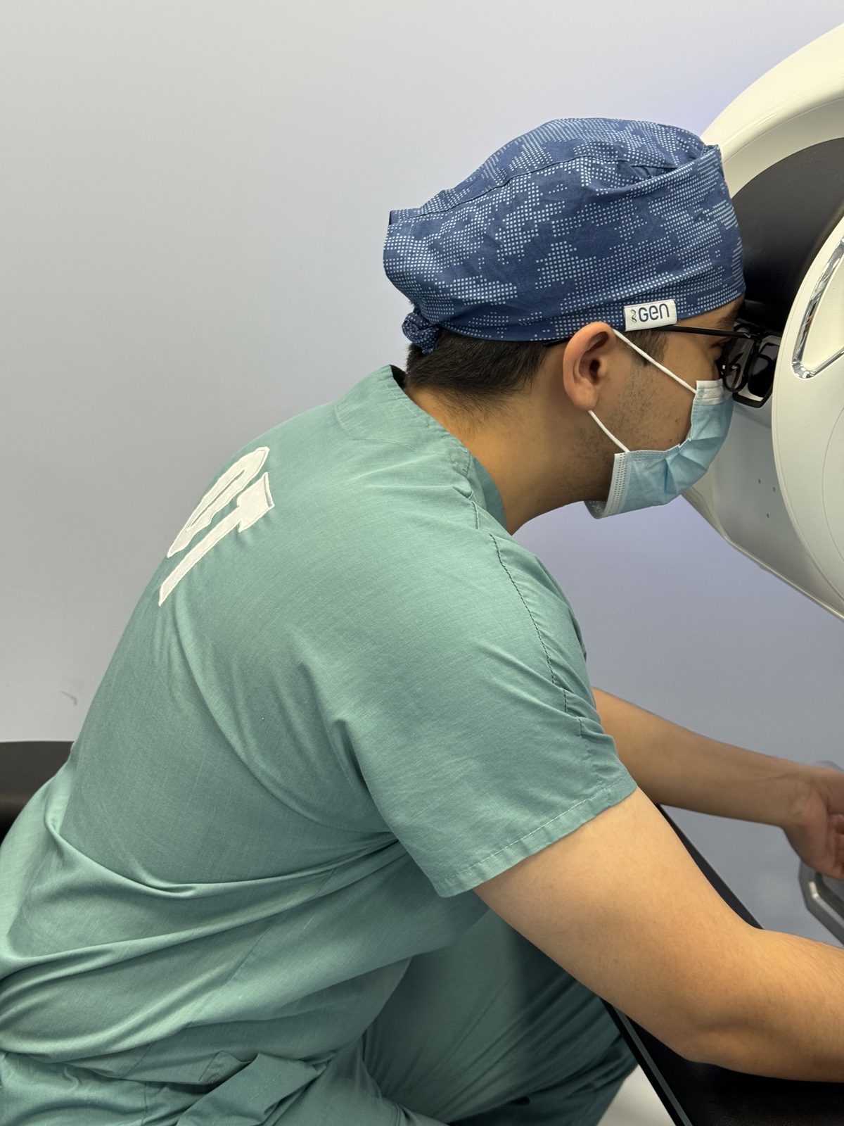 Asadbek Sultonov training at a surgical robot console